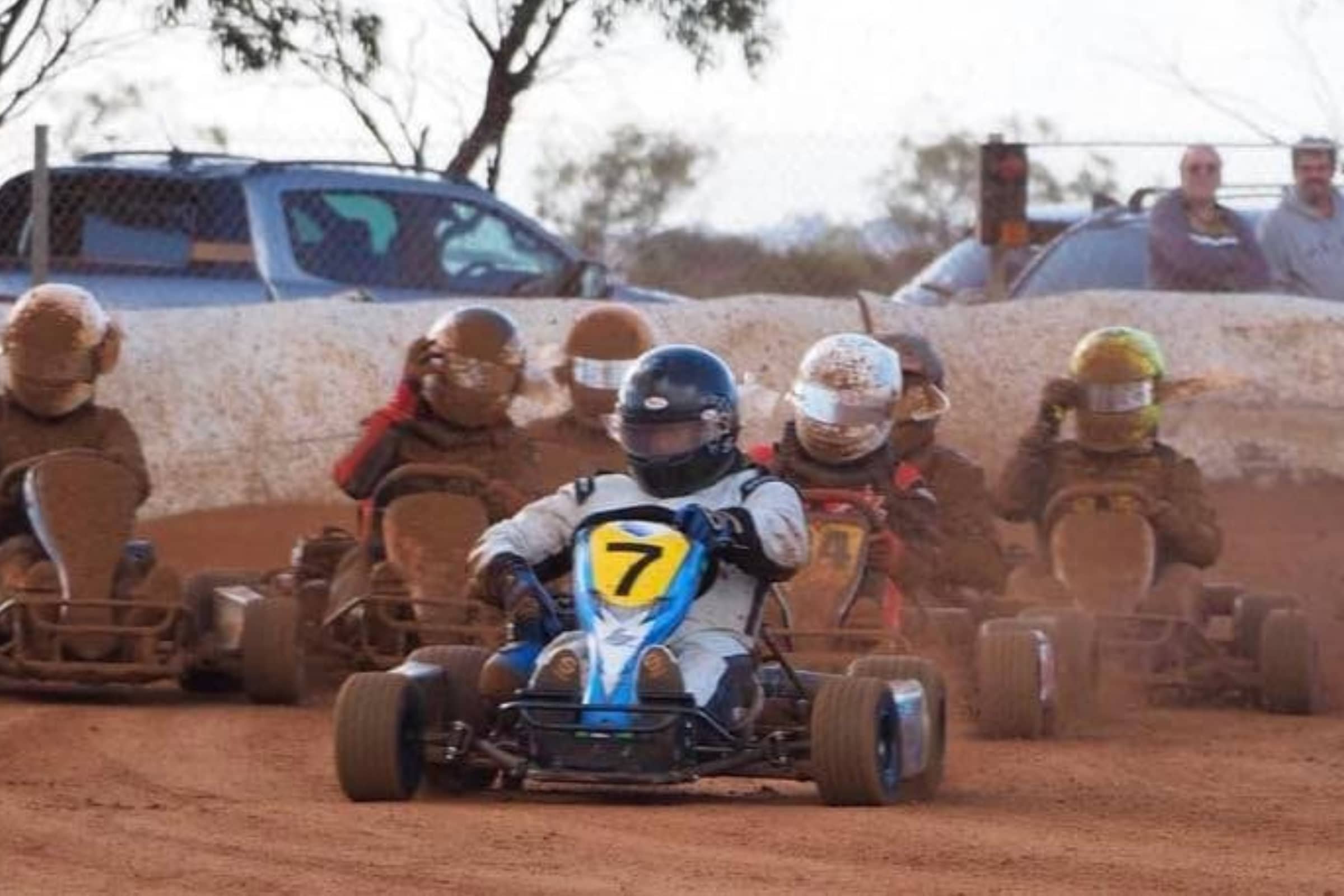 Dirt Carts on a dirt racecourse going fast
