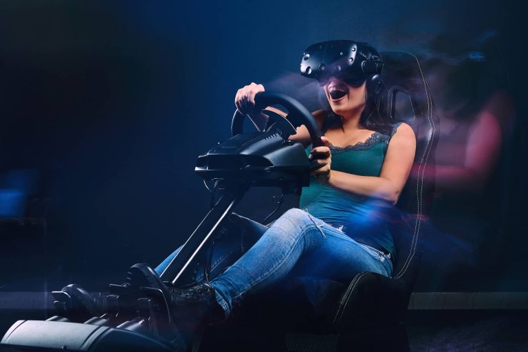 Female driving in a car racing sim smiling