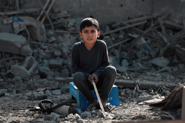 A child sitting in the Middle East