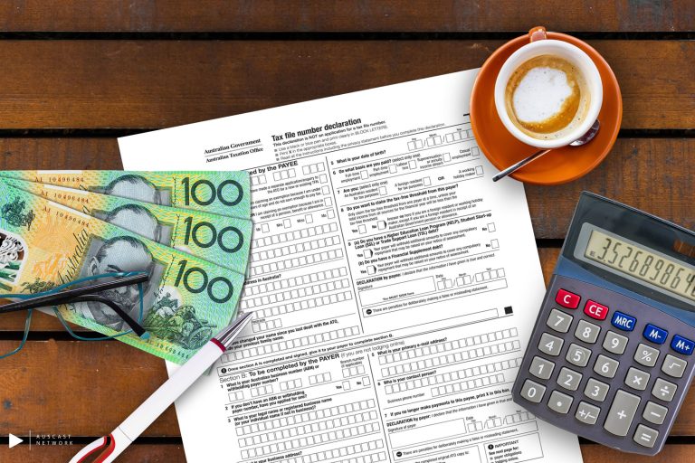 Australian $100 notes, calulator and tax form