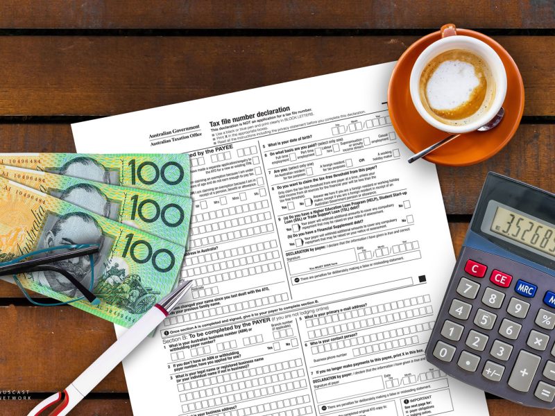 Australian $100 notes, calulator and tax form