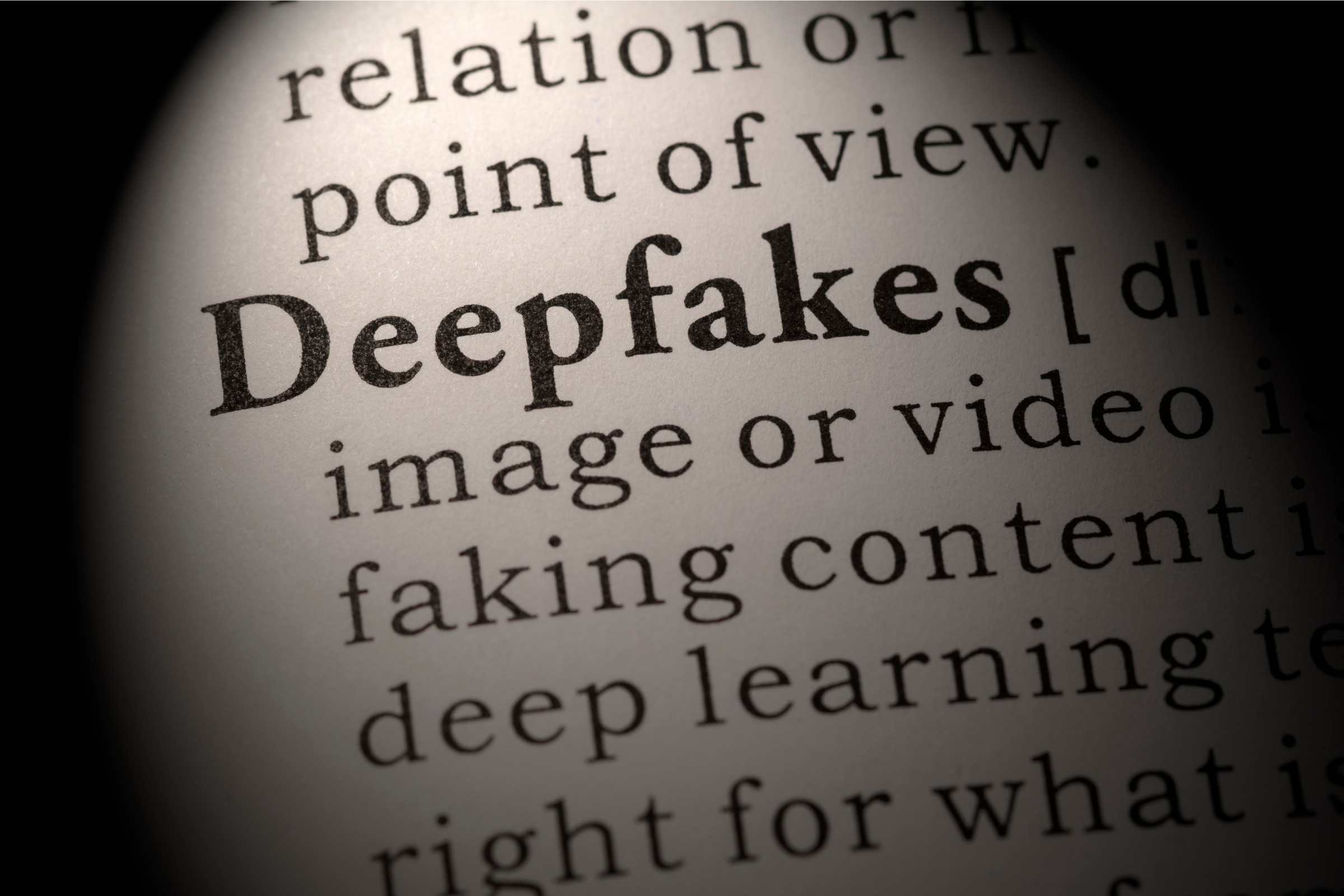 Deepfake word in a dictionary in black and white