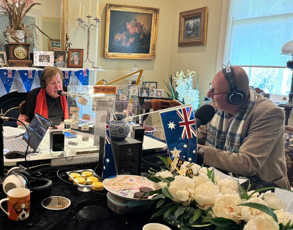 Jeremy Cordeaux and Les at the dining room table discussing qantas