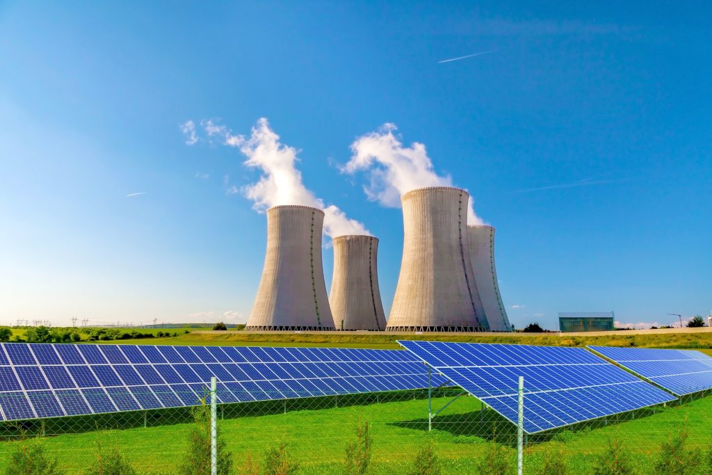 Nuclear Powerplant in the background of solar panels